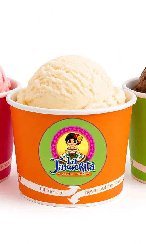 Three La Jarochita cups in pink, orange, and green, holding strawberry, vanilla, and chocolate ice cream
