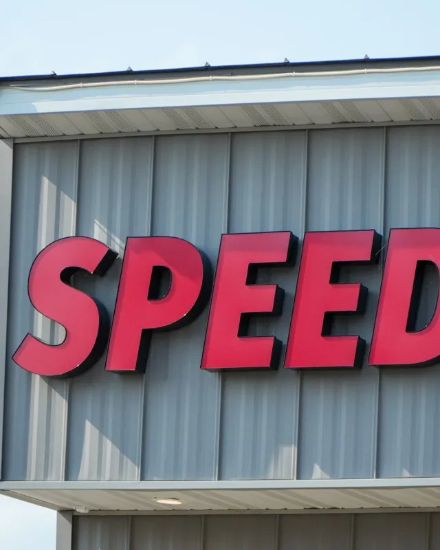 The Speedy sign in red letters across the top of the Eau Claire building