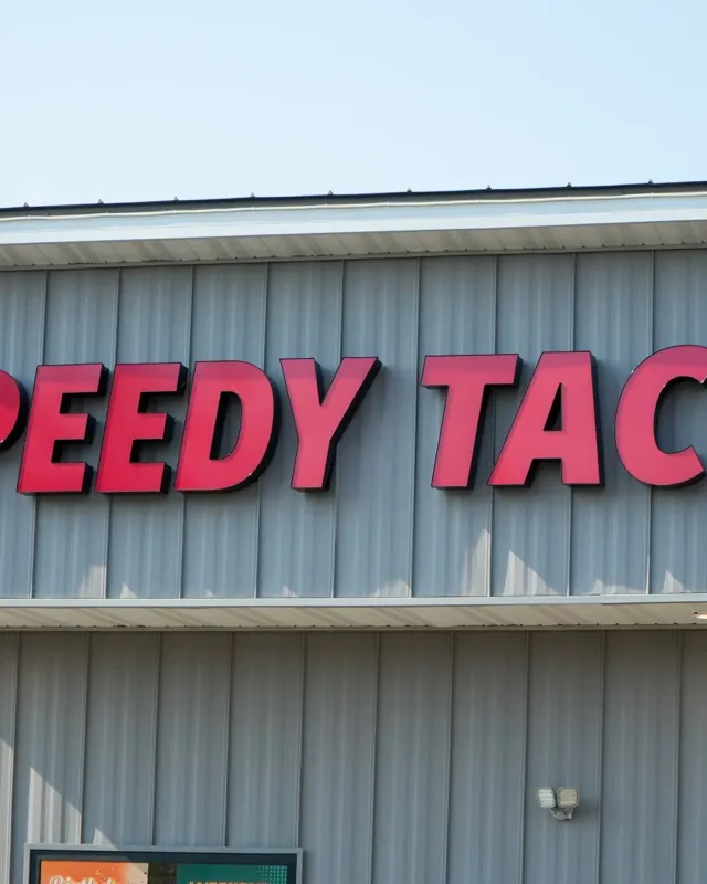 The Speedy Tacos sign above the entrance in Eau Claire